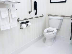 Handicapped access bathroom with grab bars and a toilet